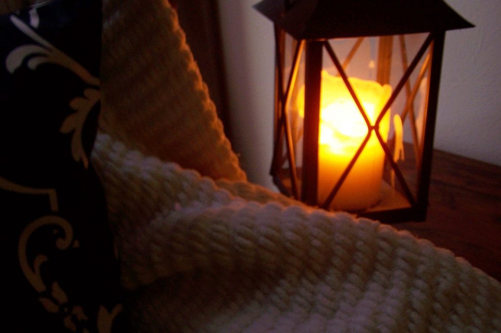 lantern, candle, blanket